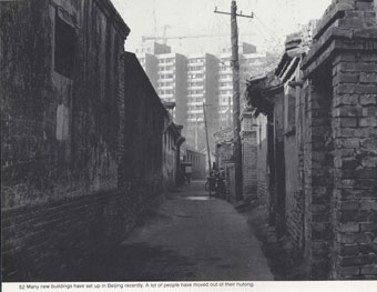 Hutong Neighborhood with Modern Apartment Buildings in Background