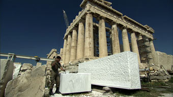 Man Working on Stones in Front of Parthenon