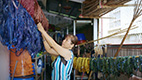 a person weaving fibers together