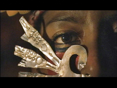 Woman in ceremonial mask