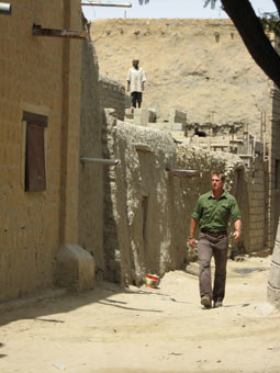 Host Walking Through Timbuktu Street